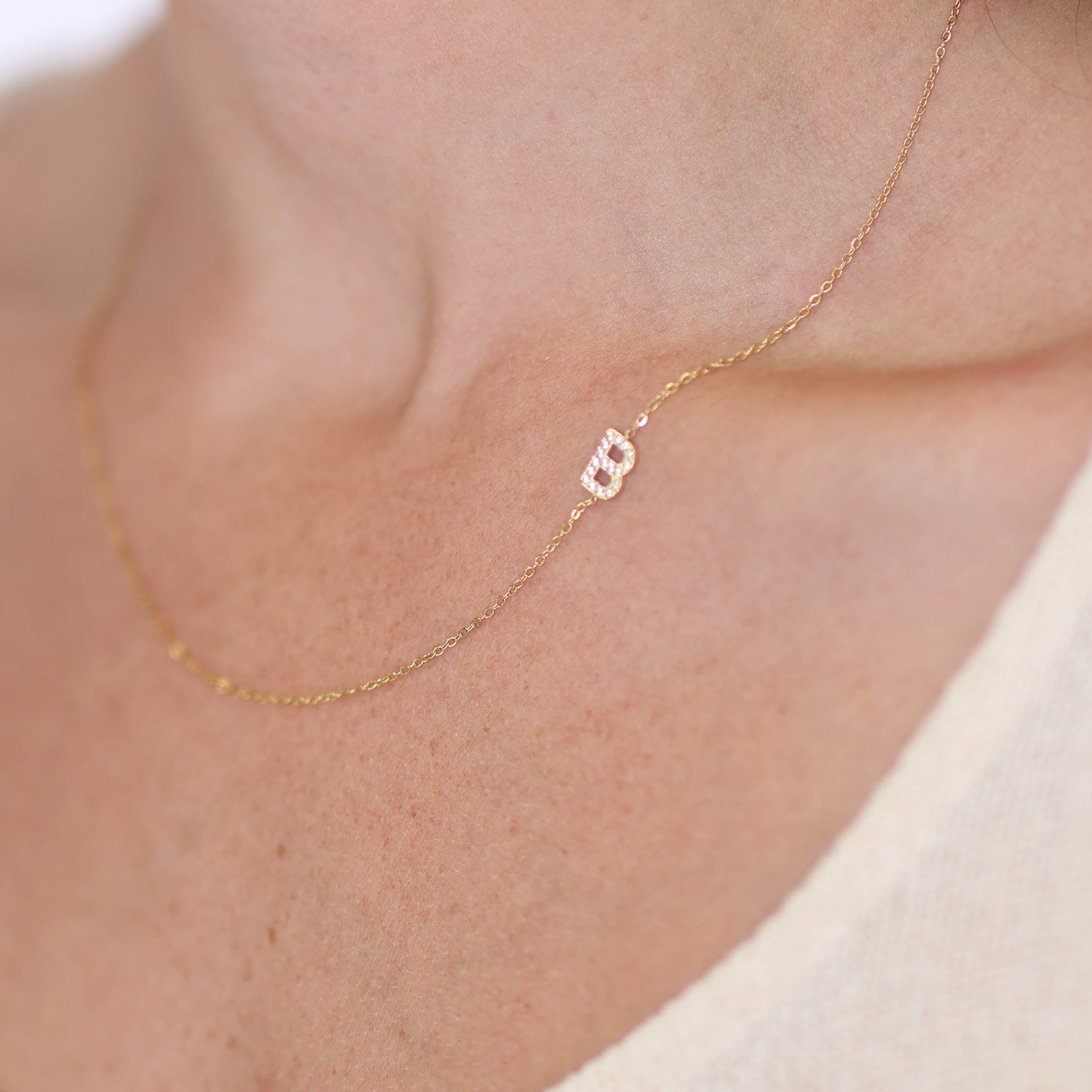 Dainty sideways initial necklace in Yellow Gold, Rose Gold or White Gold.
